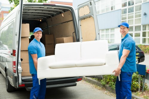 Removal team in Soho loading boxes with ethical business commitment