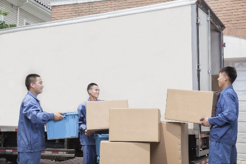 A moving team organizing household items during unpacking in Soho