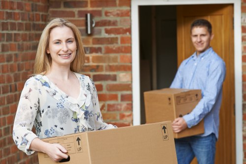 Professional movers loading office equipment for a Soho business move