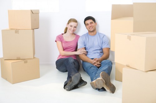 Local removal team handling furniture in central London