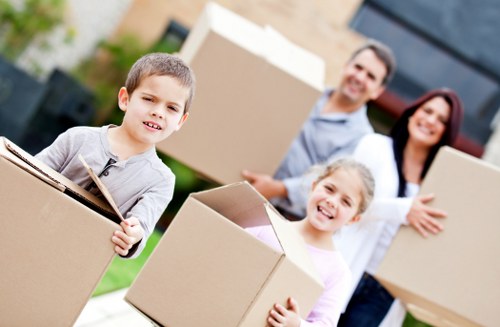 Professional movers packing furniture for a Soho relocation