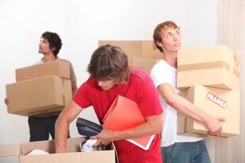 Team packing and organising equipment for a Soho office relocation