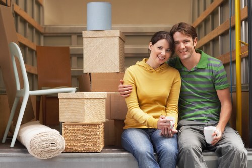 Professional movers discussing a relocation plan in Soho