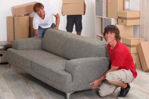 Movers handling furniture carefully during a house relocation