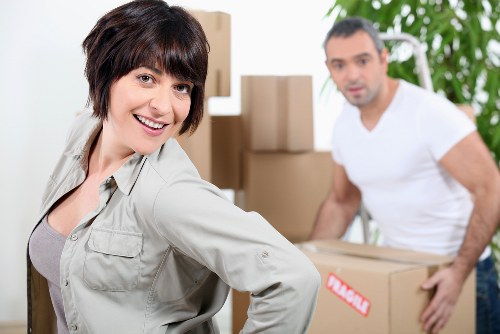 Movers carrying boxes in central London