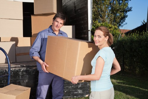 Removal staff handling fragile items in a London move