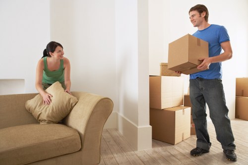 Man and van movers loading items for a Soho removal job